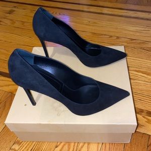 Black pointy toe pumps